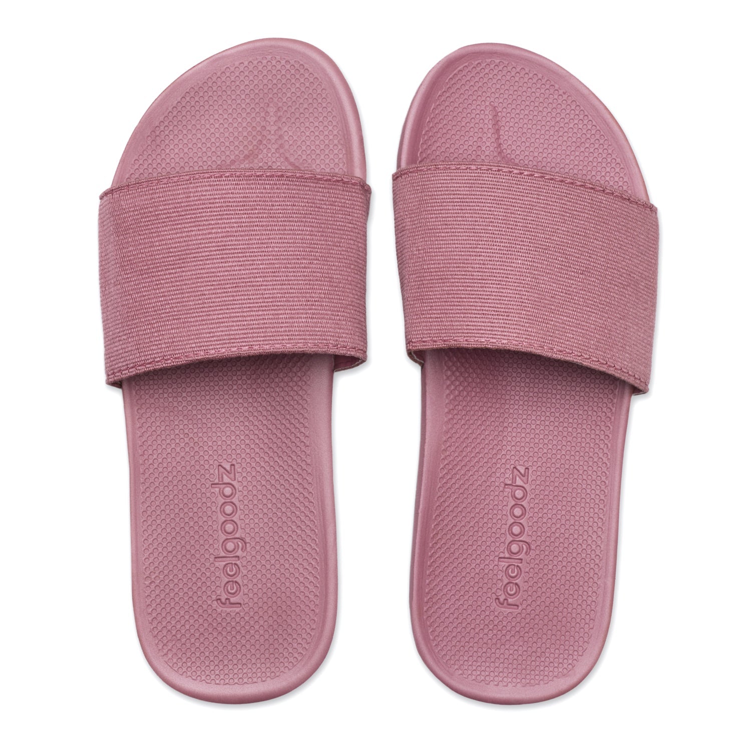 Pair of pink slides with 'foolgoodz' branding on a white background