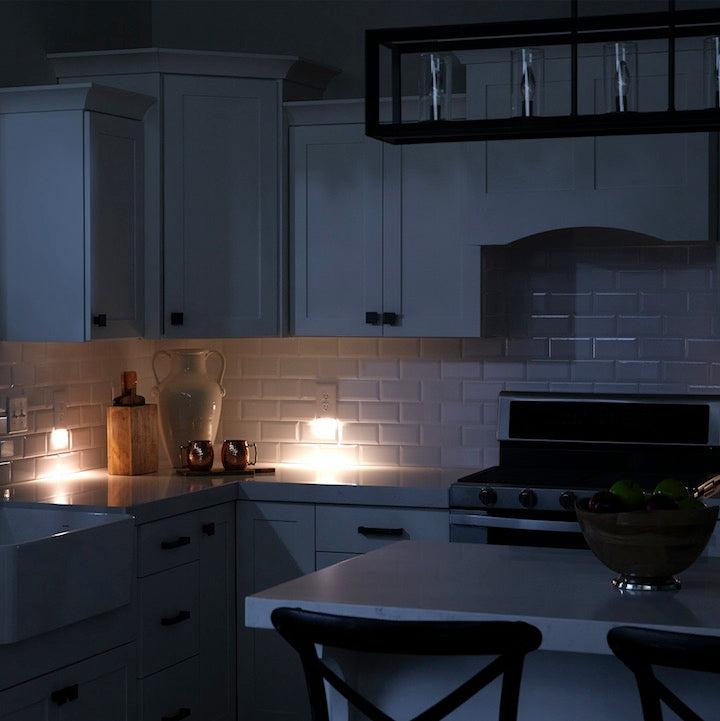 Dark kitchen with lit candles on the counter