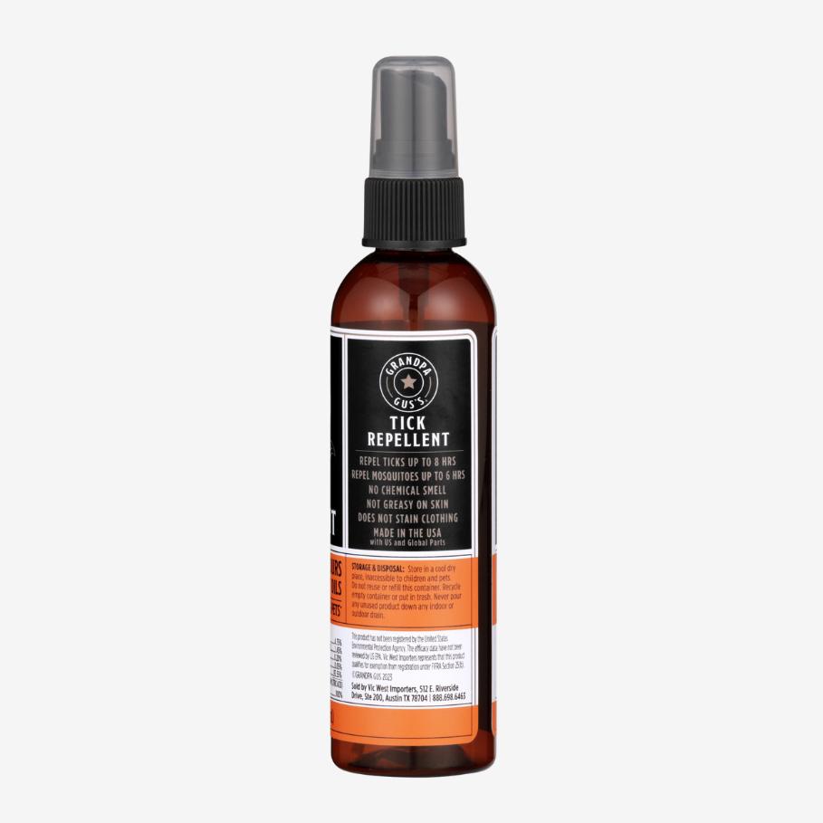 Tick repellent spray bottle with label on a white background