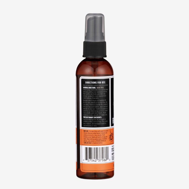 Brown spray bottle with a label on a white background