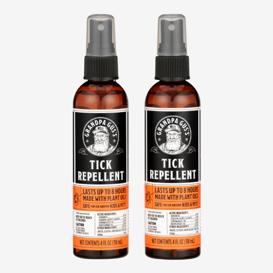 Two bottles of Grandpa Gus' Tick Repellent on a white background