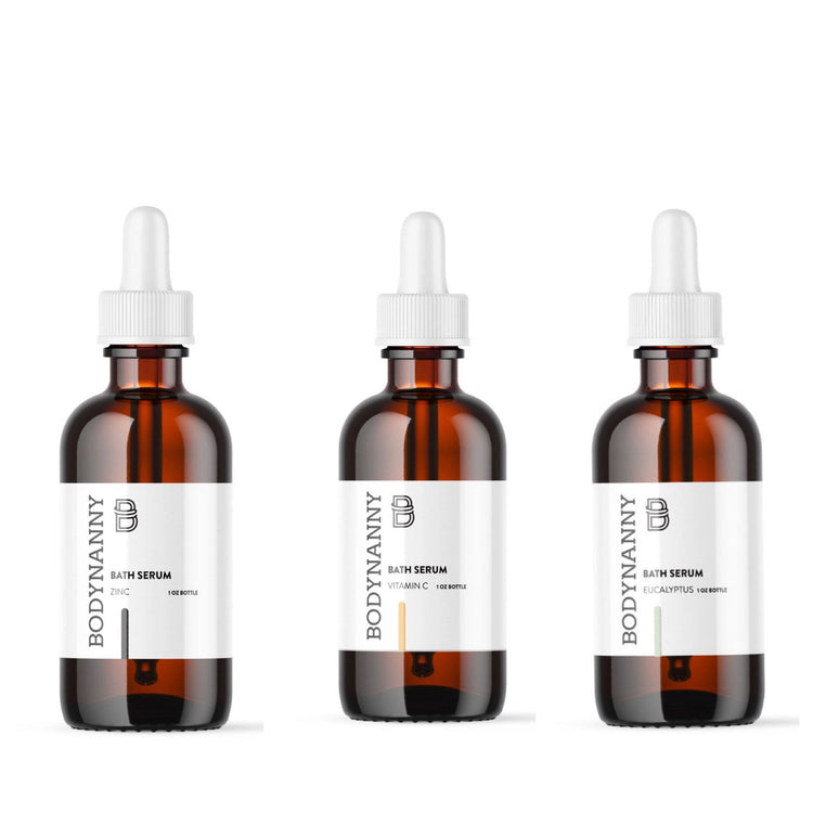 Three bottles of BODYNANNY bath serum on a white background