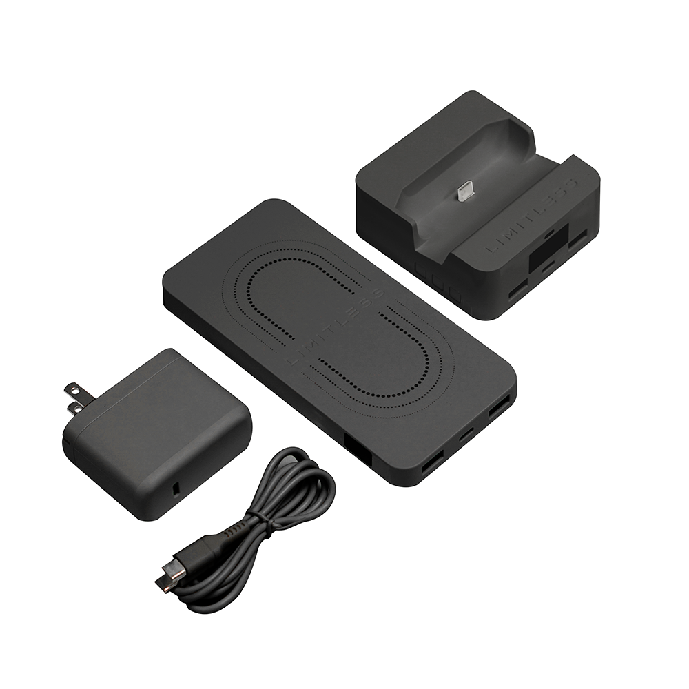 Set of black electronic components including a charger, cable, and two dock-like devices on a white background.