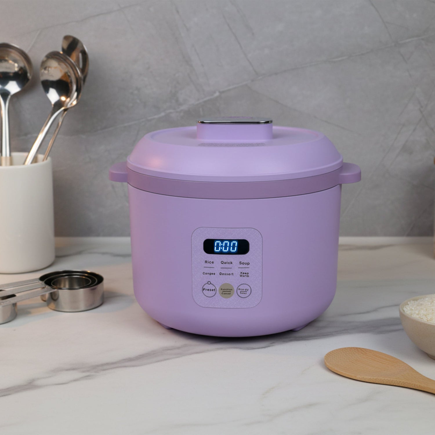 Purple rice cooker on a kitchen counter with utensils and ingredients in the background