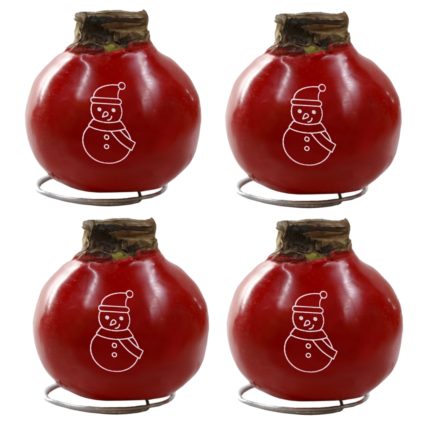 Four red tomatoes with snowman drawings on a white background