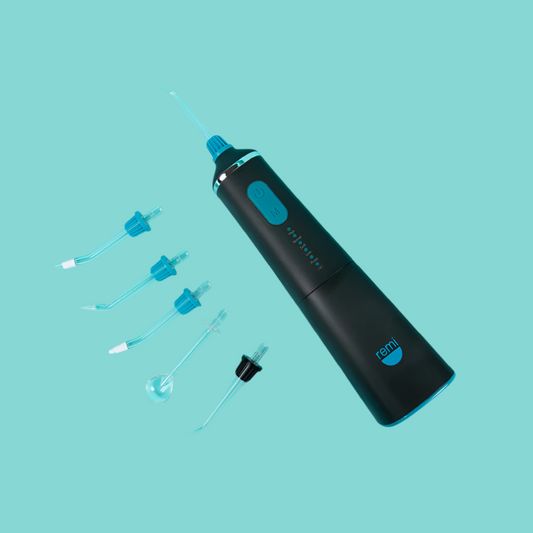 Black ear cleaning device with attachments on a teal background