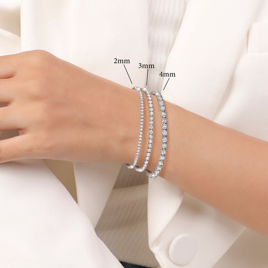 Silver bracelet with clear stones on a white background