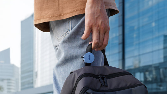 Four colorful 'roam' portable device cases stacked on a light gray background.