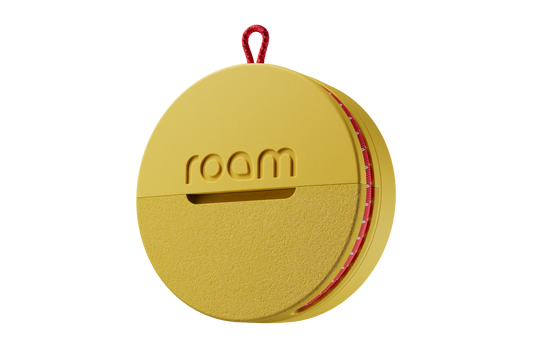 Yellow circular device with 'room' branding on a white background