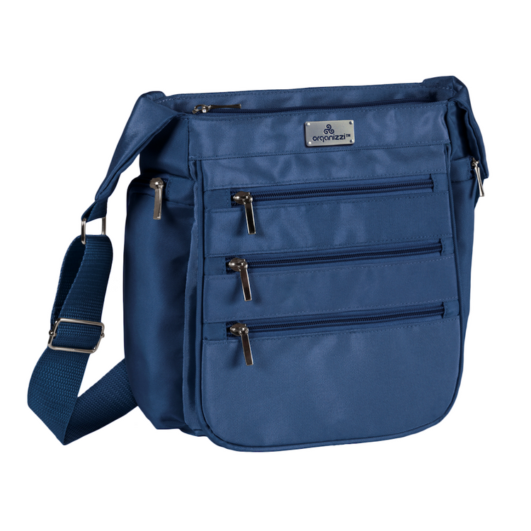 Blue shoulder bag with multiple zippers on a white background