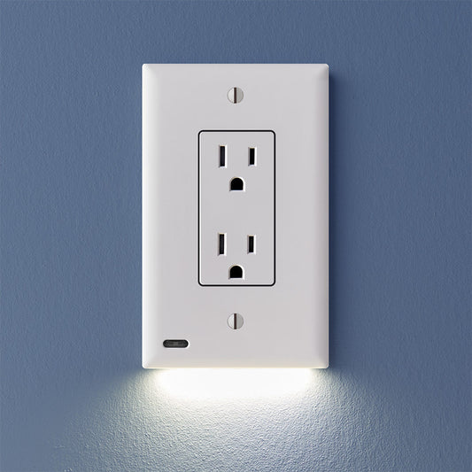A white 2-pack of GuideLight outlet cover plates with built-in LED lights, mounted on a blue wall with the outlets visible at the bottom.