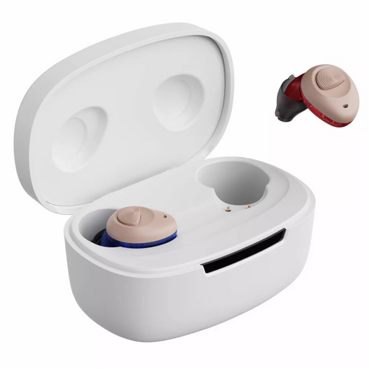 A pair of beige behind-the-ear hearing aids with blue and red accents, shown alongside their white charging case on a clean white background.