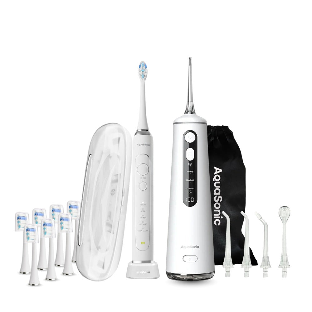 AquaSonic dental care system with water flosser, brush heads, and carrying case on a white background