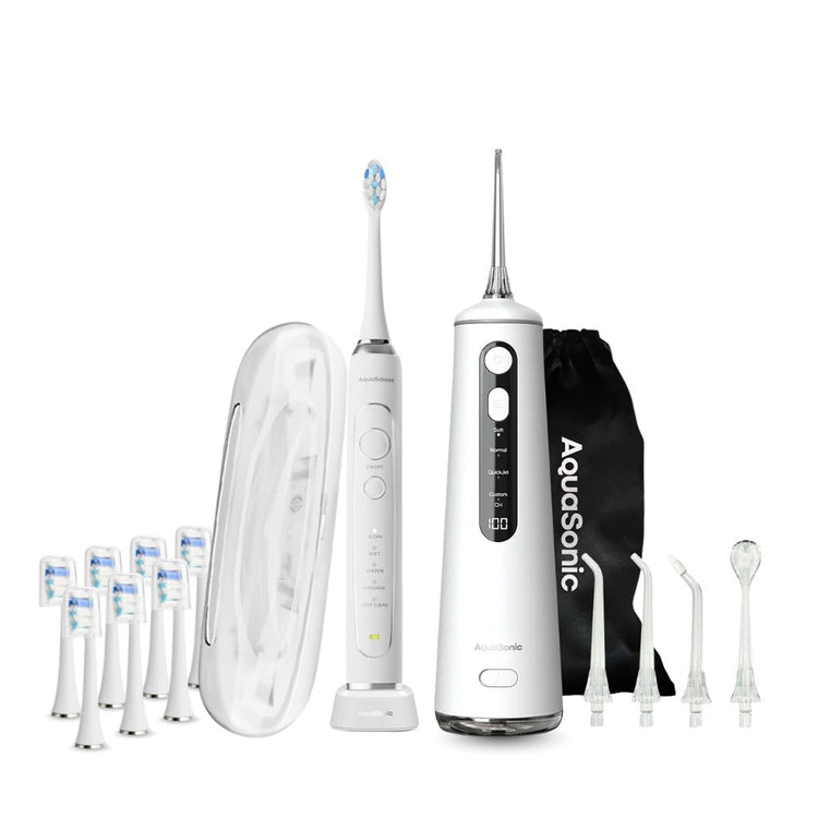 AquaSonic dental care system with water flosser, brush heads, and carrying case on a white background