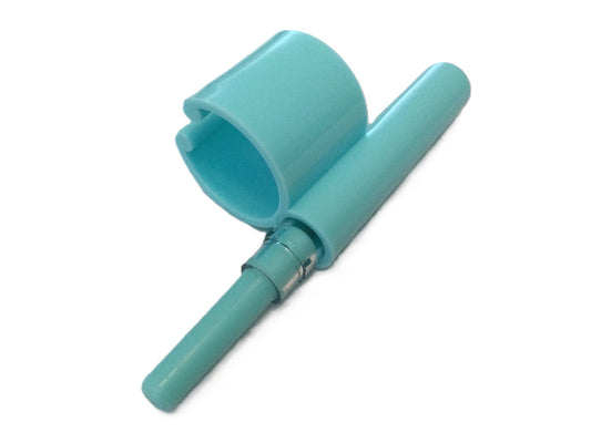 Cleaning tool with extra battery pack and replacement bristles on a white background