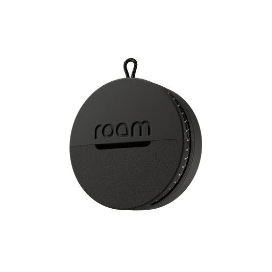 Roam smart tracker professional black single unit with 'roam' branding on transparent background, side angle view showing circular GPS tracker