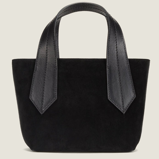 SIDE SHOT OF THE TAB TOTE MINI IN BLACK SUEDE AND CROSSBODY STRAP