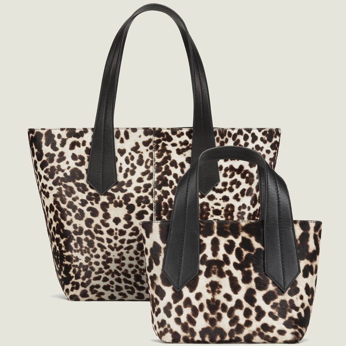 FRONT SHOT OF THE TAB TOTE MINI IN SNOW LEOPARD AND TAB TOTE IN SNOW LEOPARD