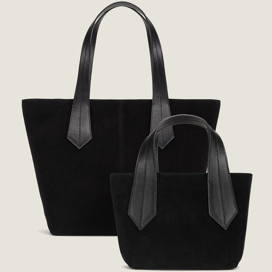 SIDE SHOT OF THE TAB TOTE MINI IN BLACK SUEDE AND CROSSBODY STRAP