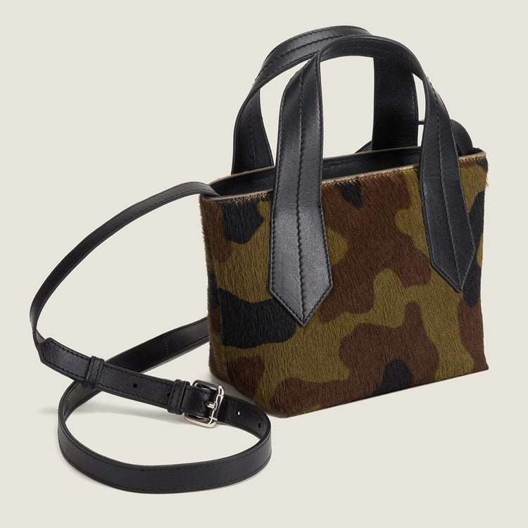 SIDE SHOT OF THE TAB TOTE MINI IN CAMO HAIR CALF AND LEATHER CROSSBODY STRAP
