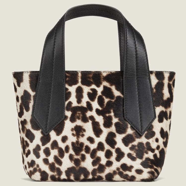 FRONT SHOT OF THE TAB TOTE MINI IN SNOW LEOPARD