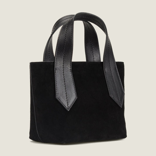 SIDE SHOT OF THE TAB TOTE MINI IN BLACK SUEDE AND CROSSBODY STRAP